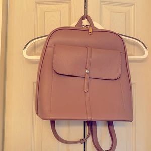 Awesome backpack. Mauve/tanish color, great neutral !
